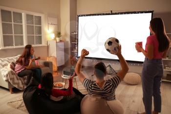 Young friends watching sports at home�
