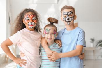 Funny children with face painting at home�