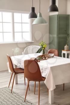 Interior of modern stylish dining room with floral decor�