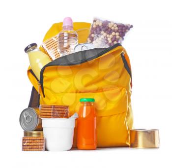 Schoolbag with different products on white background. Concept of Backpack Food Program�