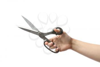 Female hand with tailor's scissors on white background�
