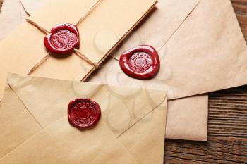 Envelopes with notary public wax seals on table, closeup�