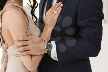 Young couple wearing stylish accessories indoors�