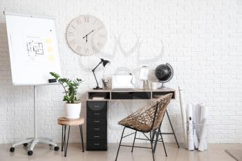 Stylish workplace with modern gadgets in office�