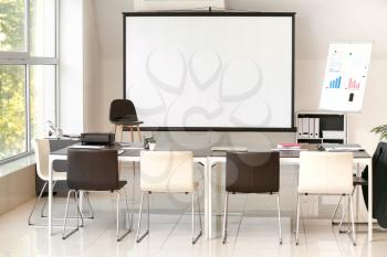 Room with projector prepared for conference in office�