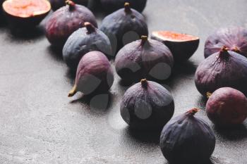 Fresh ripe figs on dark background�