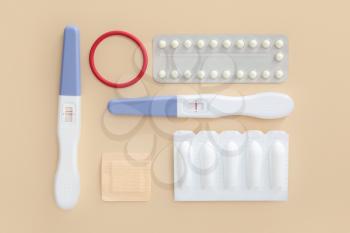 Different contraceptives and pregnancy tests on color background�