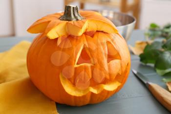 Carved Halloween pumpkin on table�