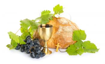Chalice of wine, cross and bread on white background�