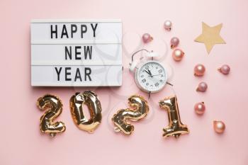 New Year composition with clock on color background�