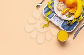Fresh products, scales and measuring tape on color background. Diet concept�