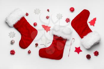 Composition with Christmas socks on white background�