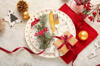 Beautiful Christmas table setting with mistletoe on white background�