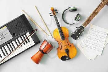 Different musical instruments and music notes on light background�