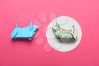 Origami bulls as symbol of year 2021 on color background�