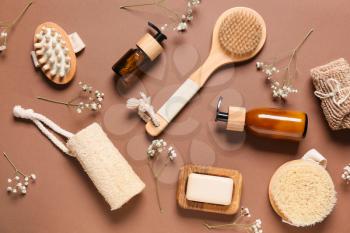 Composition with massage brushes and bath supplies on color background�