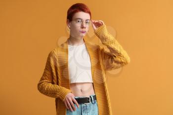 Non-binary teenager on color background�
