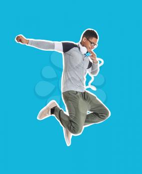 Jumping African-American teenage boy on color background�