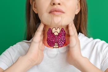 Woman with thyroid gland problem on color background �