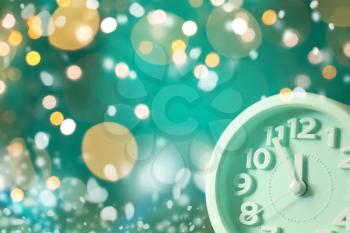 Clock against blurred lights. Christmas countdown�