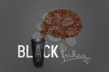 Cup with coffee beans and text Black Friday on dark background�