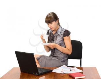 Royalty Free Photo of a Woman at a Computer With a Coffee