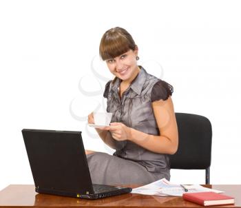 Royalty Free Photo of a Woman at a Desk With Coffee
