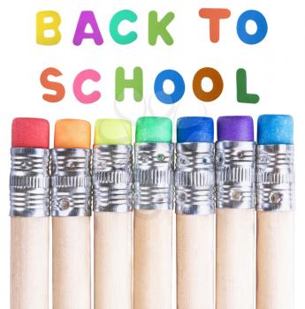 back to school background with  multicolored pencils erasers