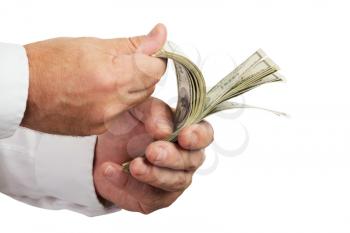 Hands of businessman holding and counting money isolated on white background.Selective focus.