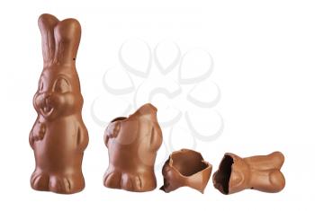 easter chocolate bunny whole and divided into pieces isolated on white