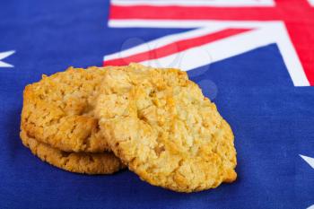 Traditional  Anzac biscuits on  Australian flag as background