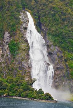 Waterfall of Milford Sound fiord, 
Fiordland National Park, New Zealand,wind and weather