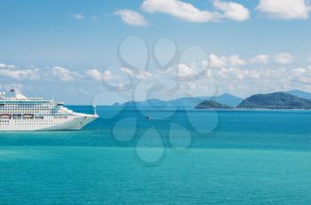 view of beautiful  coastline with anchored cruise ship