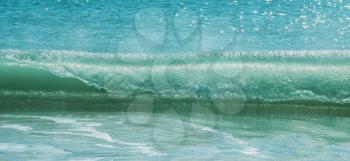 Blue ocean waves breaking on the shore of Western Australia