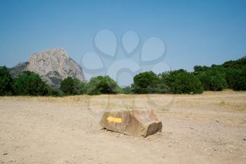 Royalty Free Photo of an Arrow on a Stone in the Desert