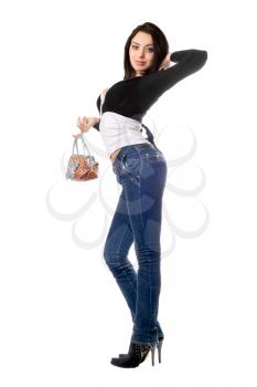 Royalty Free Photo of a Smiling Young Woman in Jeans Holding a Handbag