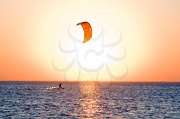 Royalty Free Photo of a Kitesurfer at Sunset