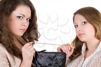 Royalty Free Photo of Two Girls Fighting Over a Handbag
