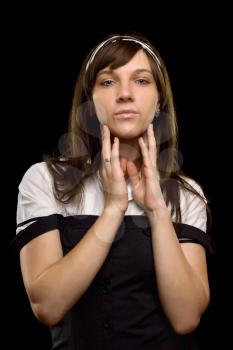Royalty Free Photo of a Young Woman With Her Hands at her Face
