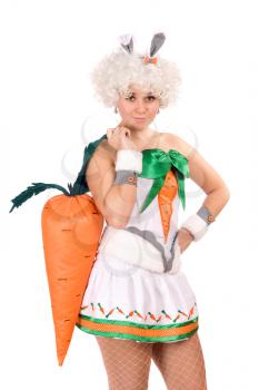 Royalty Free Photo of a Girl in a Bunny Suit Holding a Large Carrot