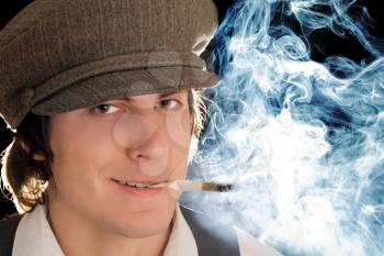 Royalty Free Photo of a Young Man Smoking