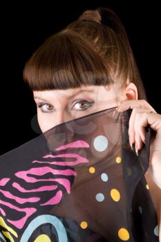 Royalty Free Photo of a Woman Hiding Behind a Scarf