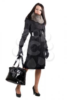Royalty Free Photo of a Woman Holding a Large Black Bag