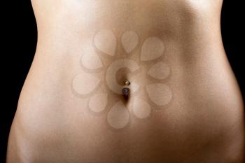 Royalty Free Photo of a Bare Abdomen With a Navel Piercing