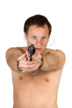 Royalty Free Photo of a Man in Handcuffs Holding a Gun