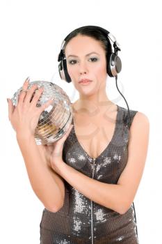 Young woman in headphones with a mirror ball. Isolated