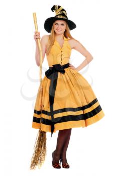 Smiling young woman with a besom wearing costume witch. Isolated