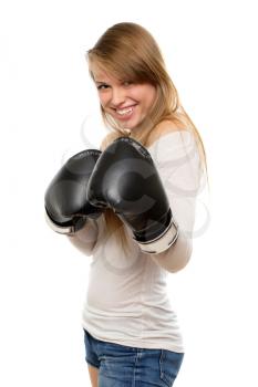 Young playful woman posing in boxing gloves. Isolated