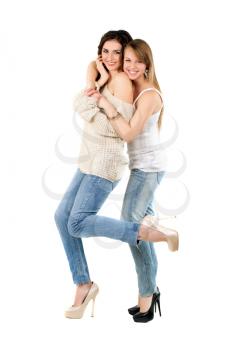 Two smiling caucasian women dressed in casual clothing. Isolated on white
