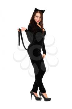 Sexy playful brunette dressed as black cat. Isolated on white